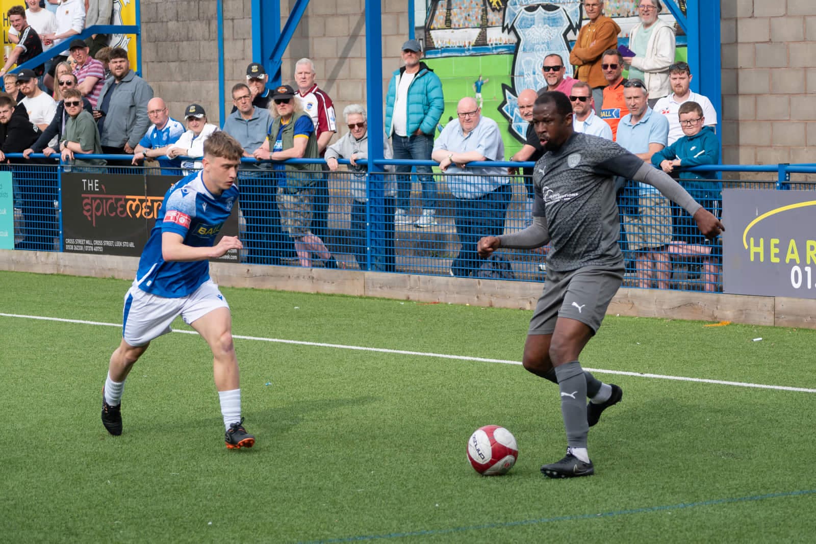 Leek Town vs Workington non‑league match action with players and ball