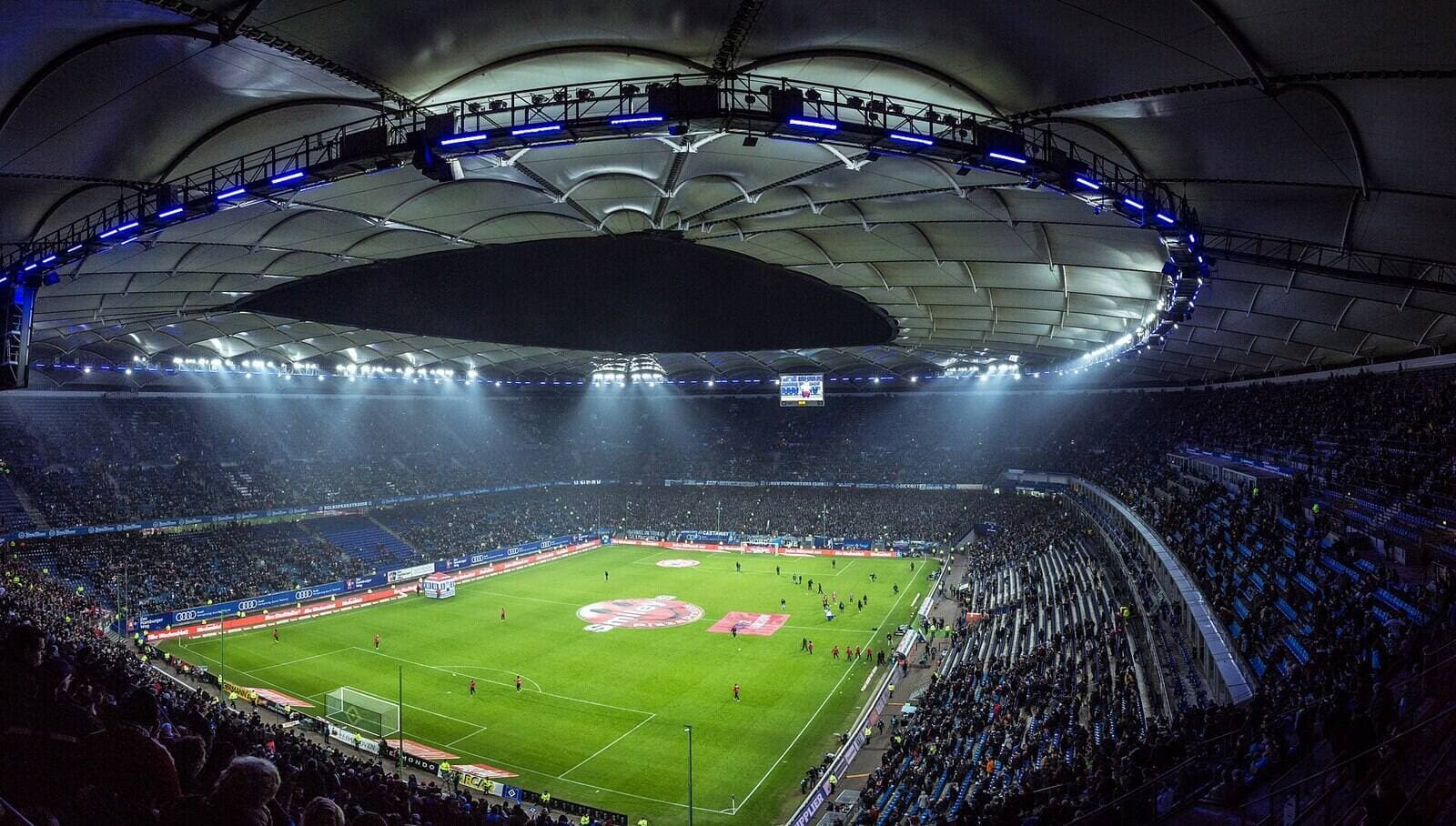 Volksparkstadion Hamburg at night (illustrative)