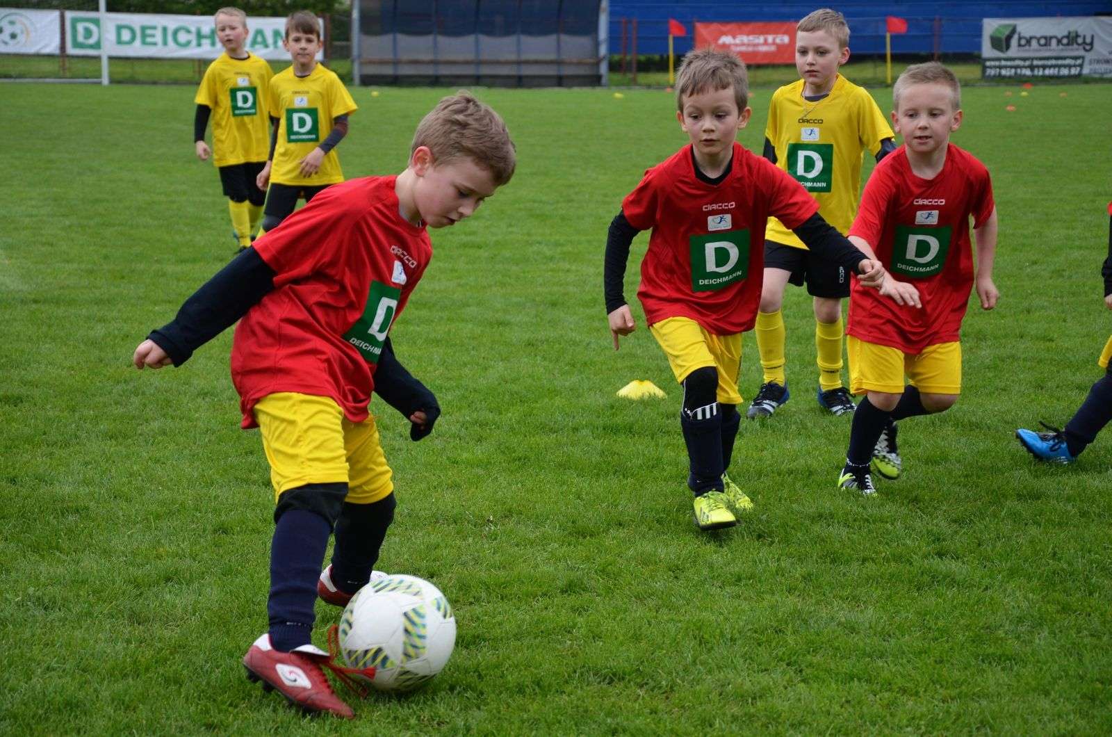 Children playing football in a youth tournament